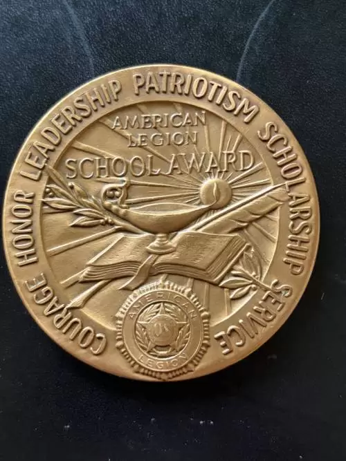 American Legion School Award medal, obverse, inscribed Courage Honor Leadership Patriotism Scholarship Service